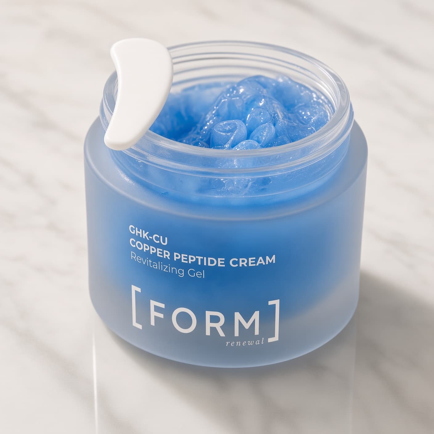 FORM GHK-Cu Copper Peptide Capsule Cream open jar with spatula